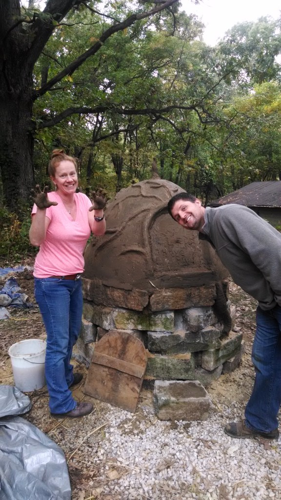 Maria and Chauncey Snodgress at the end of forming the oven.
